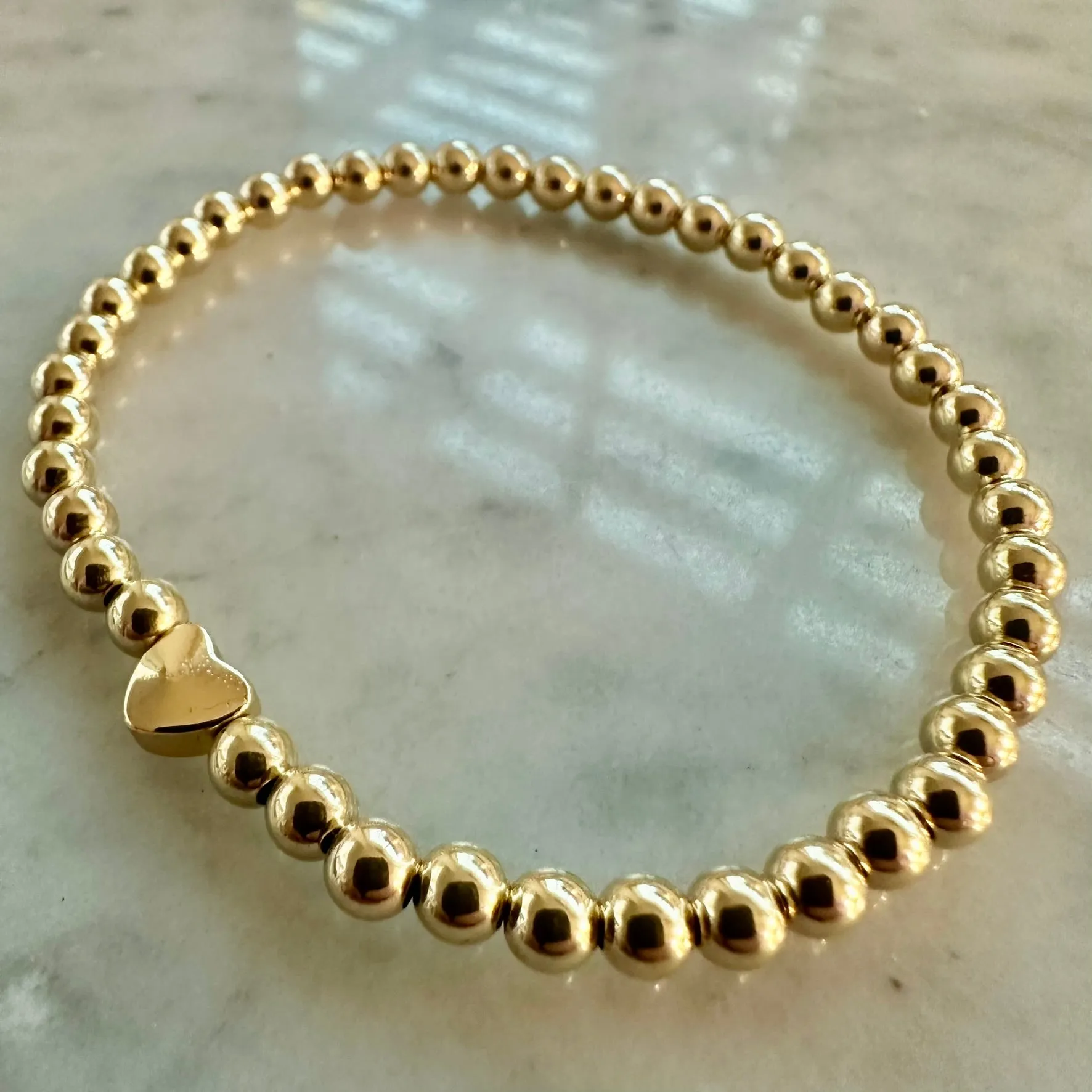 4mm Beaded Bracelet Adorned with One Heart Bead