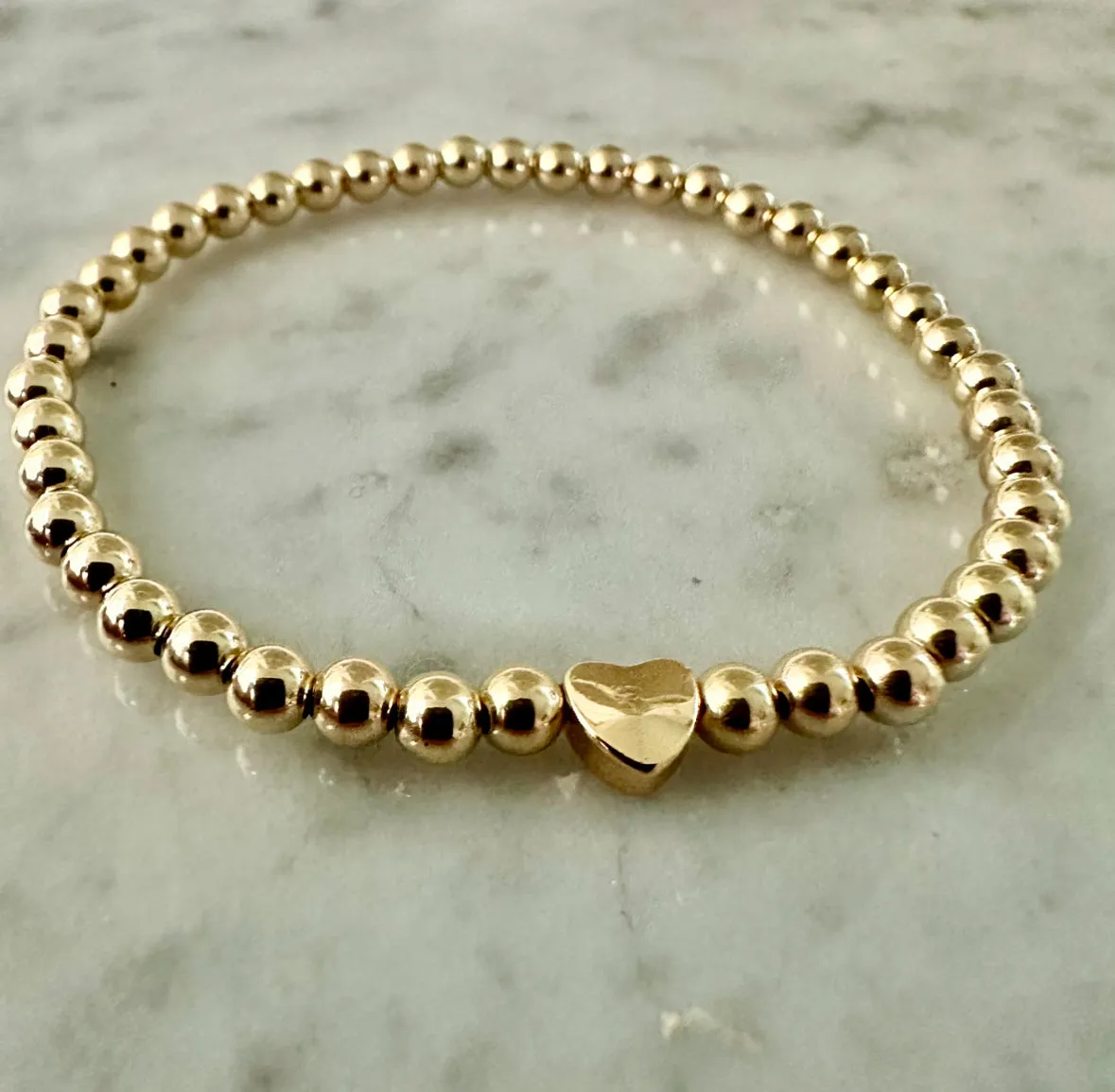 4mm Beaded Bracelet Adorned with One Heart Bead