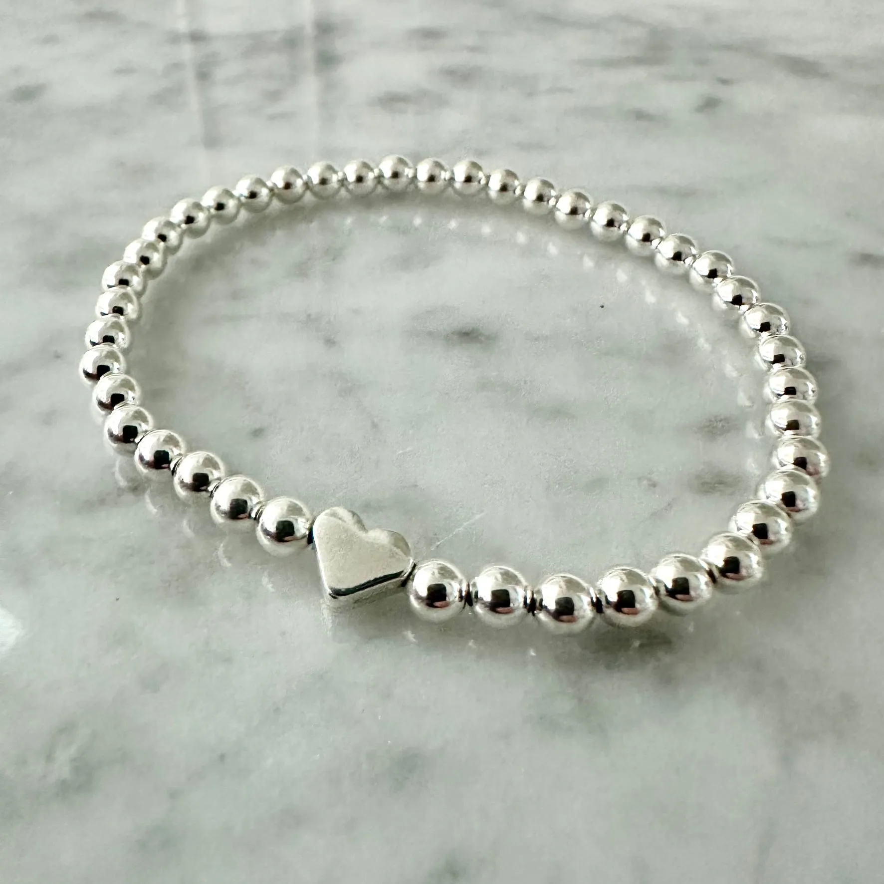 4mm Beaded Bracelet Adorned with One Heart Bead