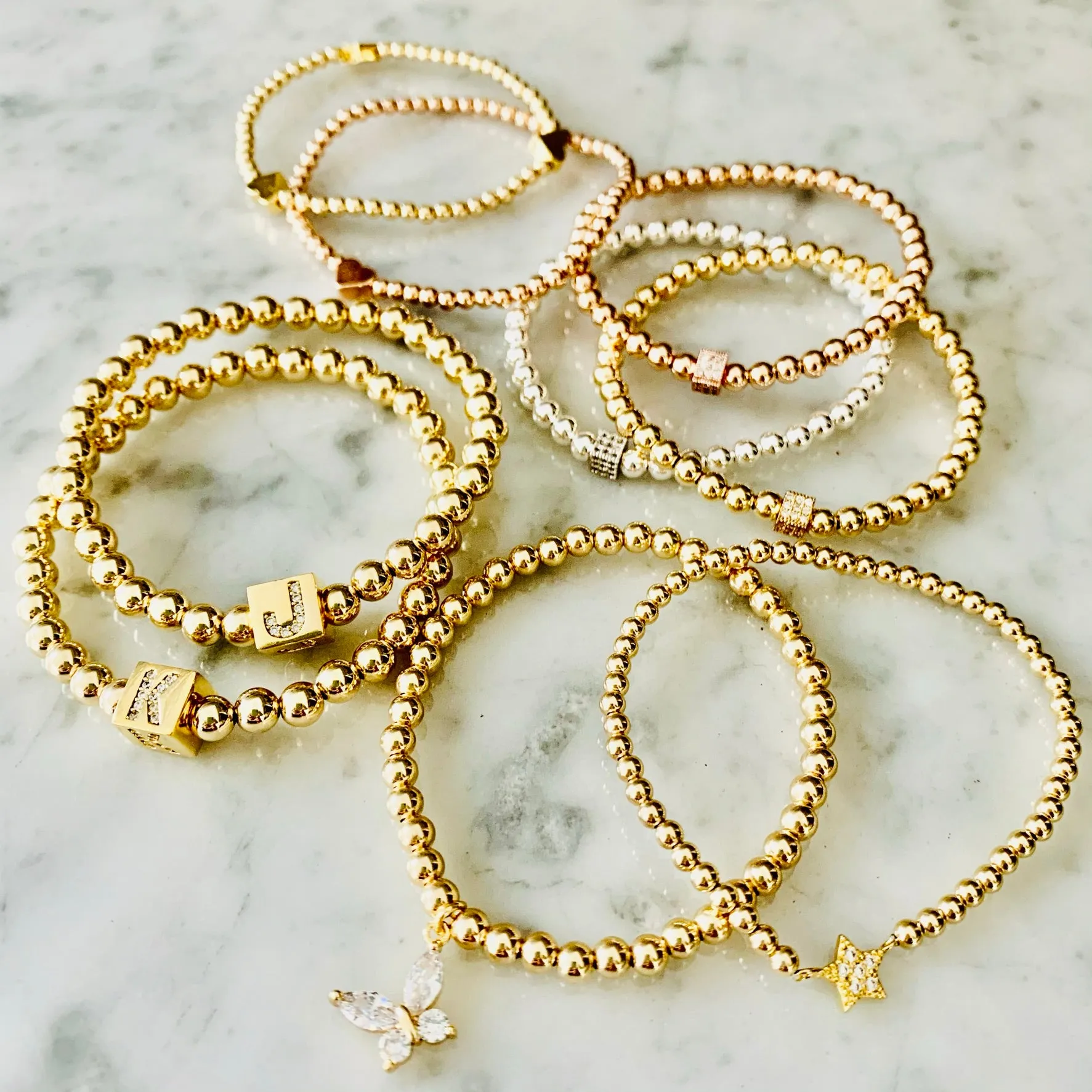 4mm Beaded Bracelet Adorned with Three Heart Beads