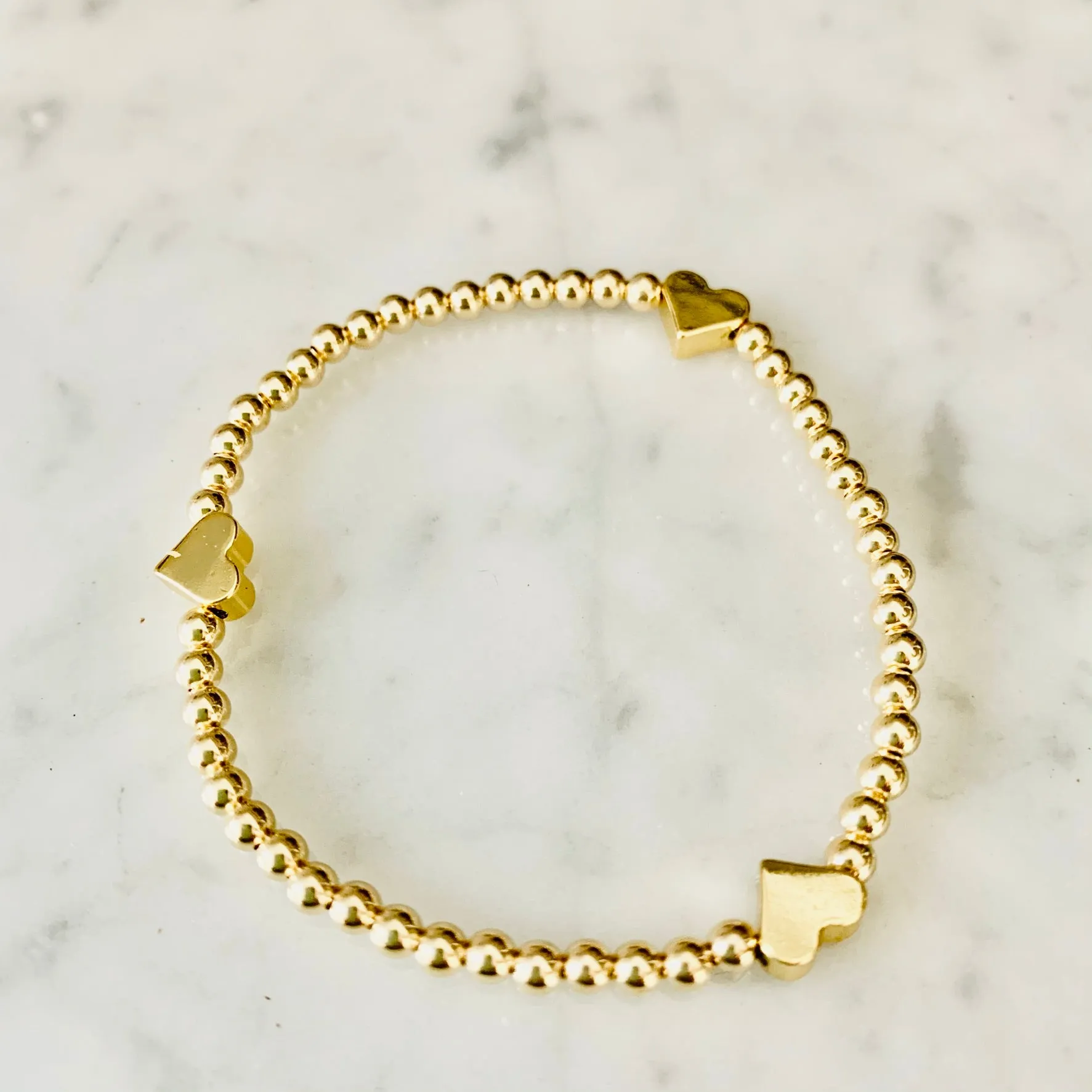 4mm Beaded Bracelet Adorned with Three Heart Beads